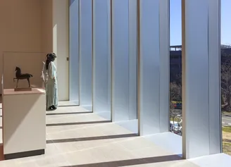 woman in sculpture gallery