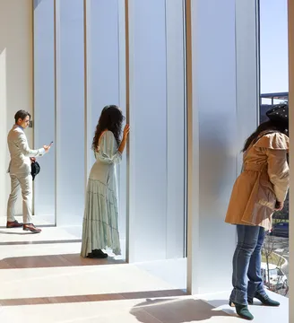 three people in the sculpture gallery