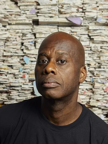 Photograph of artist Leonardo Drew from the waist up