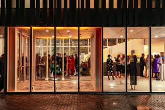 Bruce Museum Exterior entrance at night, photo by Ben Crowther