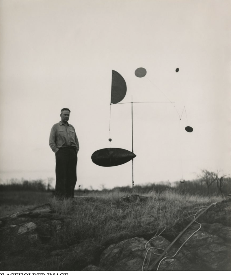Alexander Calder with Steel Fish, near his studio in Roxbury, CT, 1934 Photograph by James Thrall Soby © 2023 Calder Foundation, New York
