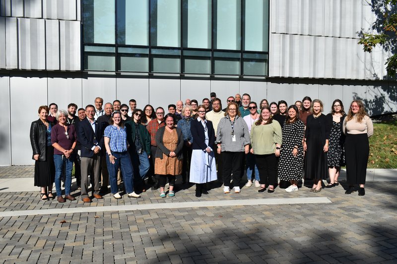 Picture of the Bruce Staff in front of the Building